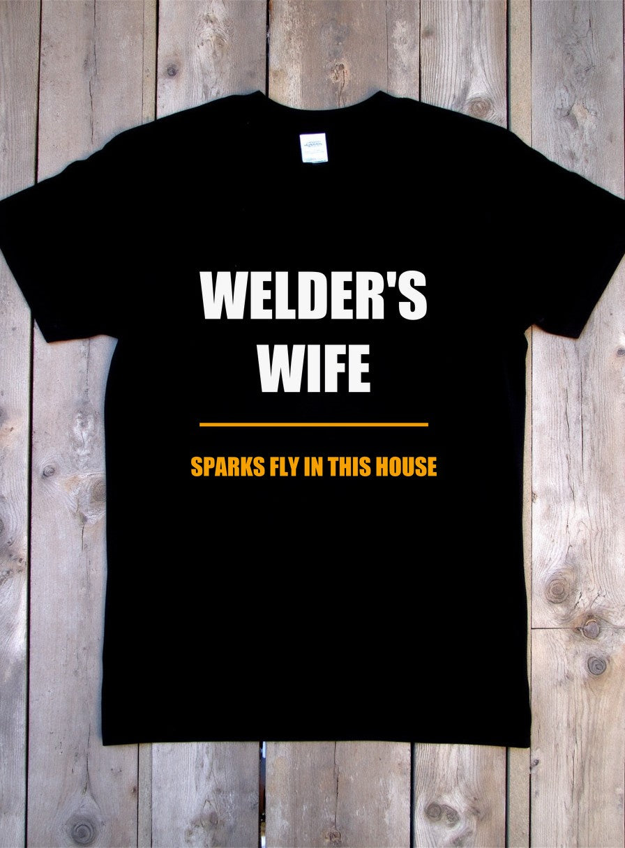 Sparks Fly In This House T-Shirt, Funny Welder's Wife Gift, Tradesman Wife Shirt — flat lay photo