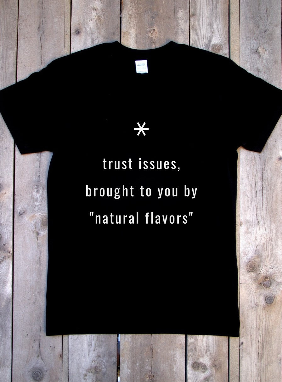 Trust Issues Brought To You By Natural Flavors Shirt — flat lay photo