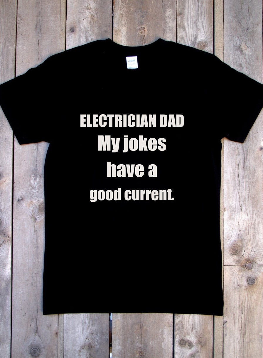 Electrician Dad Jokes Have A Good Current Shirt — flat lay photo
