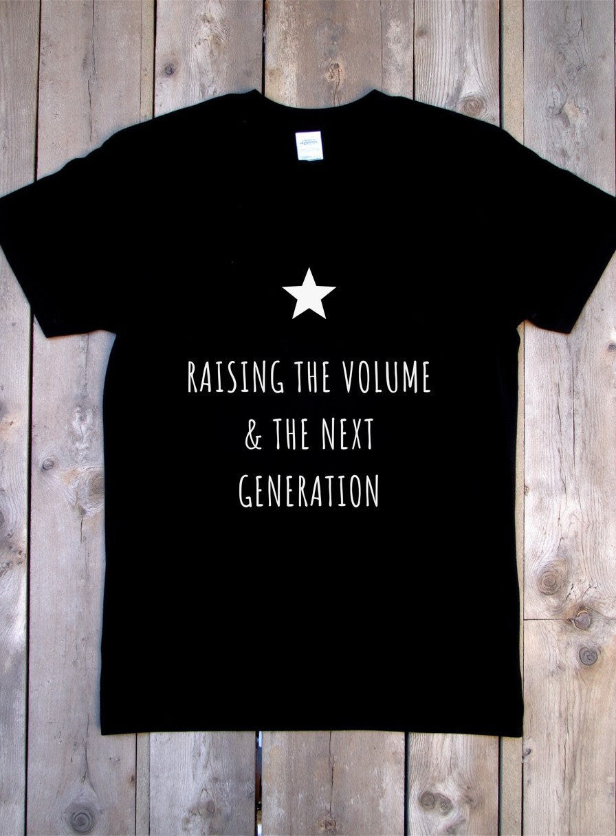 Raising The Volume And The Next Generation Shirt — flat lay photo